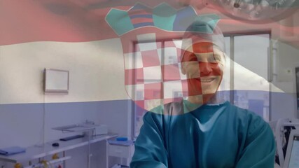 Wall Mural - Animation of flag of croatia over caucasian male surgeon smiling