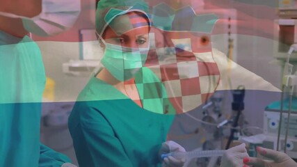 Poster - Animation of flag of croatia over caucasian surgeons during surgery