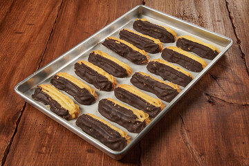 Homemade vanilla cookies, half covered in delicious bitter chocolate