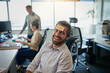 © Sanc/peopleimages.com - Office, portrait and man with sticky note, forehead and sign for happiness, corporate and motivation. Coworking, actuary and employee with humor, confident and professional with smile and reminder