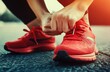 © vanzerim - Close-Up of a Person Tying their Running Shoes