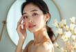 © Graphic Dude - Beautiful Asian woman healthy skin care touching face natural makeup beauty portrait cosmetic concept