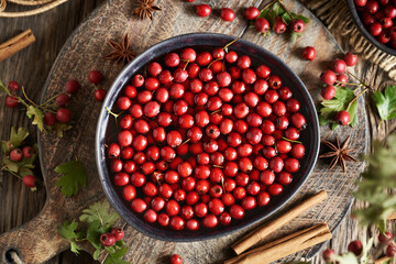 Wall Mural - Preparation of medicinal wine from fresh hawthorn berries harvested in autumn and spices