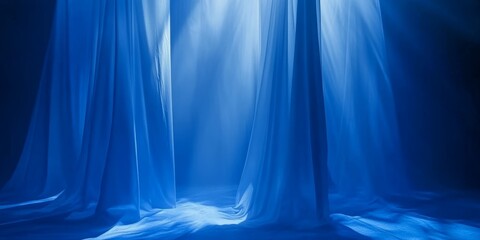 Wall Mural - Soft blue silks drape gently while illuminated by mellow light, creating a tranquil atmosphere in an indoor setting at dawn