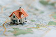 © A2Z AI  - Home Placed on a Map Representing Real Estate and Location Strategy | Planning and Property Investment