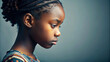 © PuriStudio - A close up side view portrait of black girl with braided hair, showcasing her thoughtful expression and unique hairstyle. soft lighting highlights her features beautifully