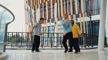 Wall Mural - Hip hop team dance break dance while multicultural friend surrounded and clapping hands to cheer or encourage his friend to dance. Active and energetic street dance. Outdoor sport 2024. Hiphop.