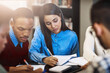 © FotoPush/peopleimages.com - University, studying and people with books at campus for education, support and learning for test. Group, students and friends with information on table for exam revision, knowledge or help in course