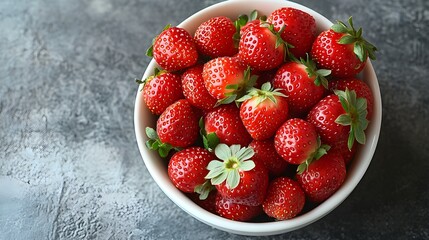 Wall Mural - a white bowl filled with fresh ripe strawberries, isolated on white