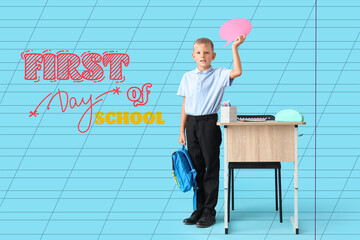 Canvas Print - Schoolboy with backpack, stationery and blank speech bubble near desk against blue background