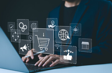 Wall Mural - shopping and e-commerce technology concept. a person using laptop with digital icons representing on