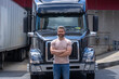 © Volodymyr - Truck driver. CDL. Portrait of trucker standing by his truck vehicle ready for transport. Male driver standing in front on his truck. Men driver near lorry trucks. Man owner truck driver. Millennial