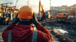 © Running opossum - Construction worker putting on his hard hat preparing to work at a noisy construction site