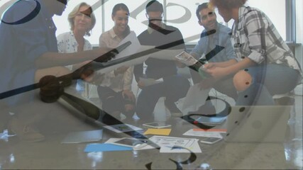 Wall Mural - Animation of moving clock over diverse colleagues having meeting in office