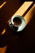 © ADDICTIVE STOCK - Artistic morning coffee with deep shadows