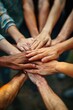 © AdriFerrer - A group of people are holding hands in a circle