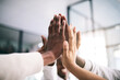 © JordaanExams/peopleimages.com - Hands, high five and success with team of business people closeup in office for motivation or support. Celebration, collaboration and partnership with employee group in workplace for goals or target