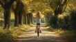 © phattharabodin - A young girl riding her bike down a tree-lined path, her hair flowing in the breeze.