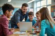 © Derek Brumby - A teacher interacts with young students gathered around a laptop, fostering collaboration and learning in a classroom environment, highlighting educational engagement and teamwork.