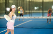 © JackF - Sporty woman playing padel on indoor court on summer day. Sport and active lifestyle concept