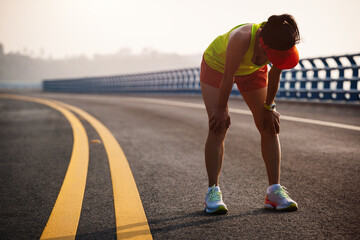 Poster - Fitness woman runner running on seaside bridge