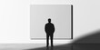 © Andres Mejia - Businessman standing looking at large blank canvas in gallery