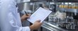 © ImagePulse - Hands holding a clipboard, inspecting a restaurant kitchen s hygiene checklist during a food safety audit, compliance focus