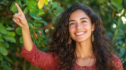 Canvas Print - Happy Woman Pointing Up With a Bright Smile Outdoors