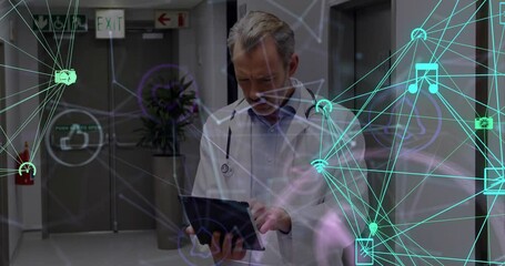 Poster - Animation of globe with connections with icons over caucasian male doctor with tablet