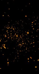 Wall Mural - flying fire sparks on black vertical background. copy space.