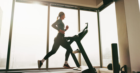 Wall Mural - Woman, fitness and running on treadmill at gym for cardio exercise, workout and training performance. Active, female person and machine for morning routine, endurance or speed challenge of resilience