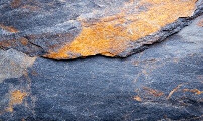 Natural Slate Rock Surface With Orange and Gray Patterns Showcasing Geological Textures