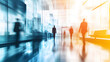 © MakeitEasy - Blurred crowd walking on a moving escalator in a bustling airport terminal
