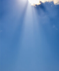 Wall Mural - sunbeam through the haze on blue sky, vertical