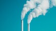 © Oatkhaphon - Industrial smokestacks releasing white steam into a clear blue sky, symbolizing pollution and environmental impact.