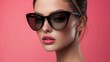 © ADD PHOTO - Fashionable Woman Wearing Stylish Sunglasses with Confident Expression on Pink Background