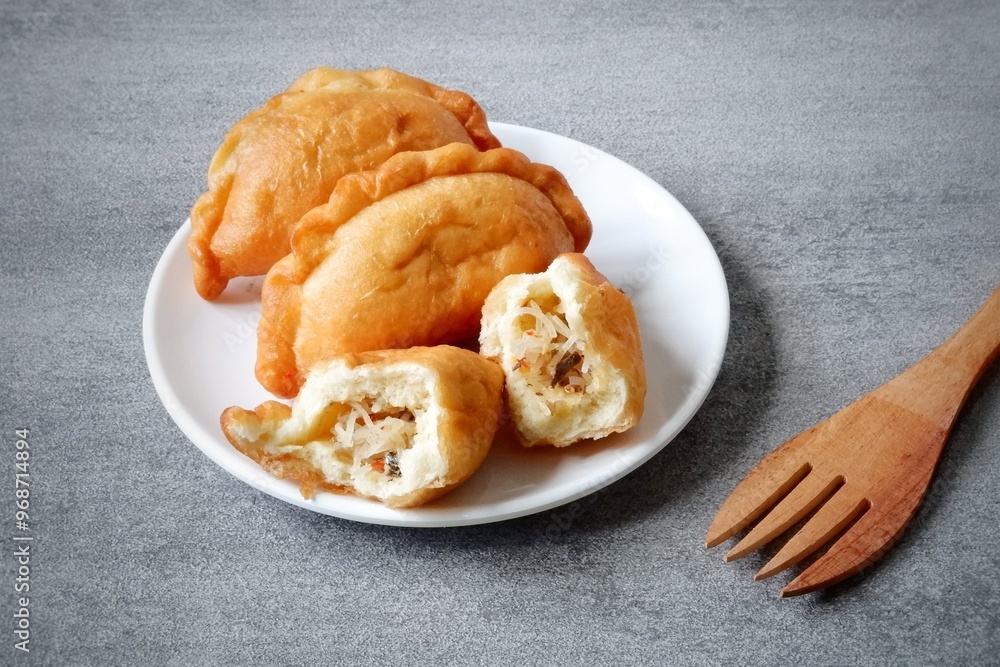 Panada is traditional snack filled with fish, vegetables and thin rice ...