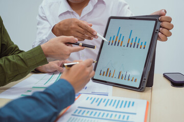 Wall Mural - Close-up of a businessman in a meeting at the office discussing topics related to digital marketing management, financial analysis, business writing, teaching, and venture capital investments.