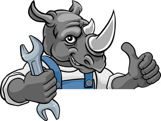 Wall Mural - A rhino cartoon animal mascot plumber, mechanic or handyman builder construction maintenance contractor peeking around a sign holding a spanner or wrench and giving a thumbs up