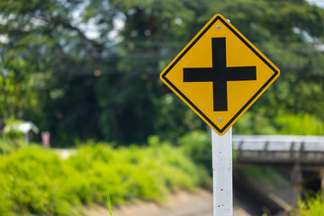 Intersection yellow traffic sign, Four cross road ahead warning, Road sign badge beware of an intersection slow speed car.