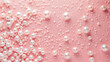 © mahamad - Pearl confetti on a pink background