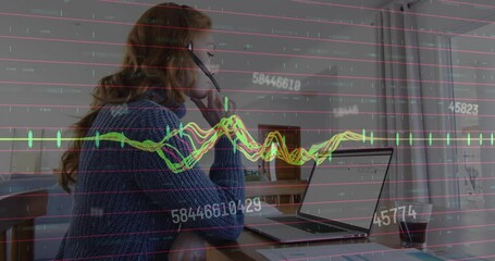 Wall Mural - Animation of financial data processing over caucasian businesswoman using laptop