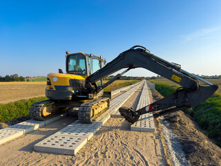 Process of making a new road with concrete slabs as a surface.