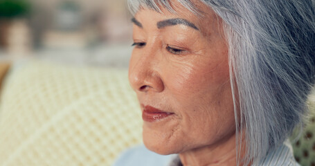 Senior woman, thinking and peace in nursing home for retirement, nostalgia and mindfulness. Elderly person, face or remember in living room with happy past memory, full life and reflection for future