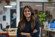 © The Picture House - Crossed arms, happy and portrait of woman in office with pride for management, creativity or career. Team, confident and young female public relations worker with smile at startup agency in Spain