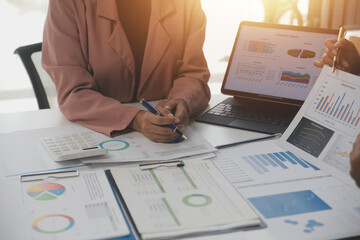 Wall Mural - Close up of Business team analyzing income charts and graphs with modern laptop computer. Business analysis and strategy concept.