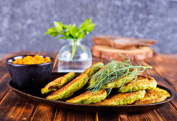 Poster - Green zucchini fritters, vegetarian zucchini pancakes with fresh herbs and garlic