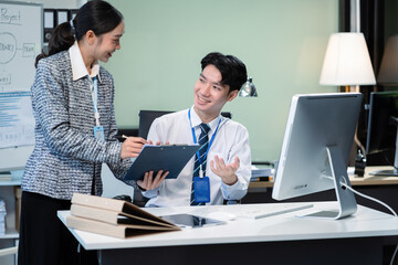 Wall Mural - Businessmen team or financial data analysts working with tablets and laptop computers and data graphs together. Plan to analyzing projects in the office.