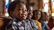 © liliyabatyrova - A group of children are sitting in a church pew, smiling