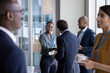 © ReeldealHD images - African American businesswoman shaking hands at a corporate networking event